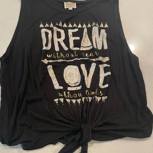 Cute tie in front tank.Size XL, but fits me well and I wear L in most everything